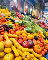 A colourful assortment of fresh fruits and vegetables at a market.