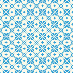 Fototapeta premium Blue pattern of petals and diamonds. White background and repeating textile pattern.