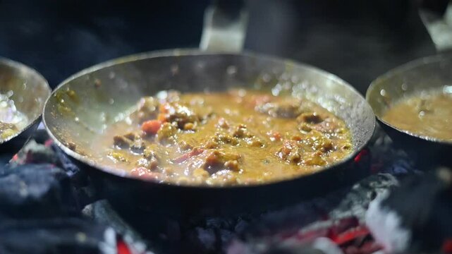 Pakistani cuisine traditional Lamb Karahi with spices and gravy close-up in a pan