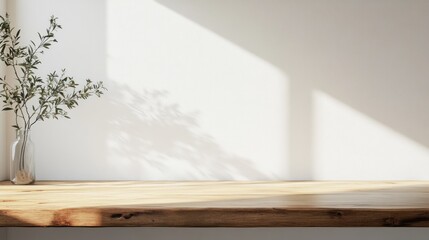Minimalist Wooden Table with Greenery and Sunlit Wall