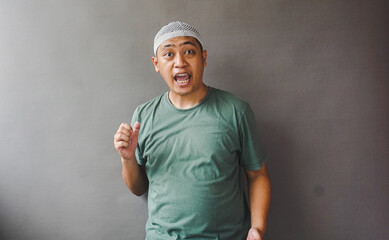Astonished Man in Green Shirt, Surprised Expression