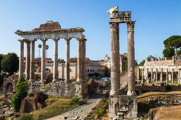 View of the ruins of the Roman Forum with the temple of Saturn and the temple of Vespasian and Titus. Rome, Italy