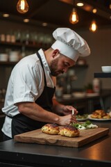 Chef preparing gourmet dish in modern kitchen during evening hours with beautifully plated food
