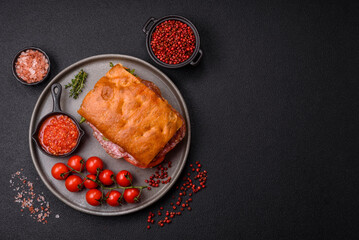 Focaccia with salami, cheese, tomatoes, arugula, salt, spices and herbs
