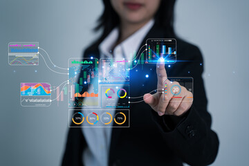 Businesswoman drawing virtual technical graph and chart for analysis stock market, tax ,technology investment and value investment concept.