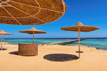 Idylic beach with sun umbrelas, Red Sea, Egypt