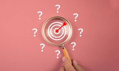 Magnifier focus to target solution target which among question icon, successful business and...