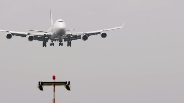Wide body airliner approaching landing. Jumbo jet arriving