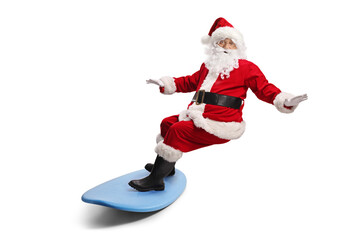 Santa claus riding a surfboard