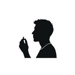 A silhouette of a person smoking a cigarette