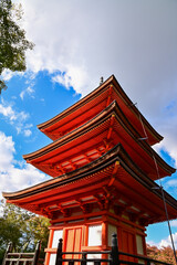 The view of kiyomizu-dera temple with trees and blue sky background in Kyoto, Japan. Major tourist attraction in Kansai region in Japan. Japan famous historic architecture. Building abstract. Travel c