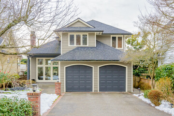 luxury house with big tree and nice landscape at winter in Vancouver, Canada