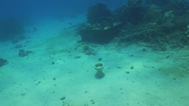 Toilet Bowls in the Wreckage of the Ship