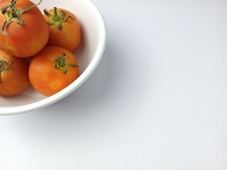 Fresh ripe tomatoes close-up photo with copy space for text isolated on white background