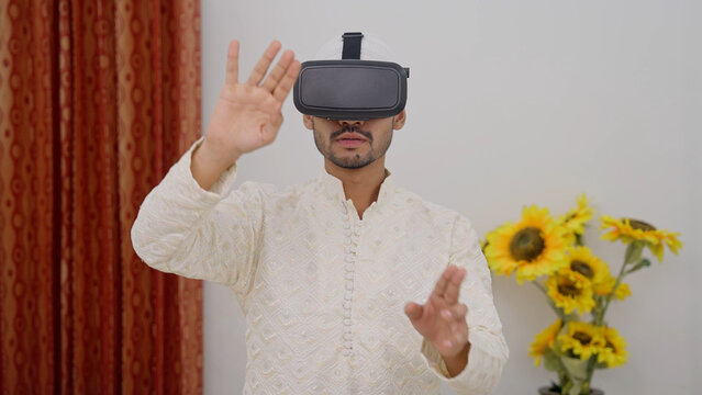 Muslim Man Zooming and Using Vertual Computer Through VR Headset