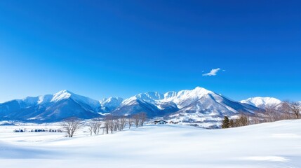 Fototapeta premium Majestic Snow Capped Mountains Against Vibrant Blue Sky in Serene Winterscape
