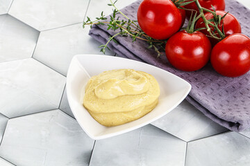 Dijon mustard sauce in the bowl