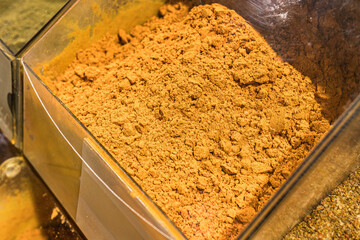 Fragrant colored bulk spices by weight. Loose red, yellow and green spices. Chopped aromatic herbs. Italian herbs. Turkish and Georgian spices. Thanksgiving day. The secret of tasty dishes.