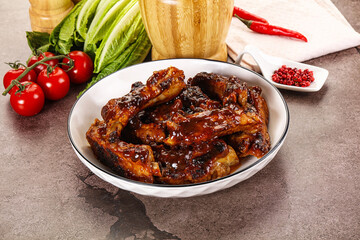 Grilled pork ribs in barbecue sauce