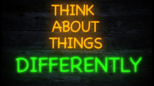 think about things differently neon effect sign on a dark background