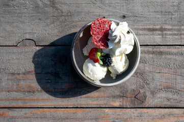 Dame Blanche cup, an ice cream sundae with vanilla, whipped cream an fruits in Zottegem, Belgium