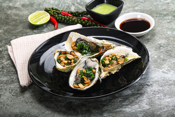 Open half oysters with green onion