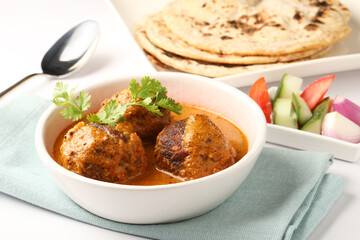 Malai Kofta Curry is an indian cuisine dish with vegetables & cottage cheese fried balls in onion...