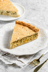 Chicken and egg pie on a light plate