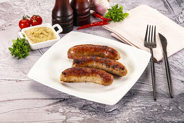 Delicous natural roasted sausages in the plate