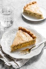 Chicken and egg pie on a light plate
