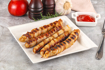 Grilled meat sausages wrapped bacon