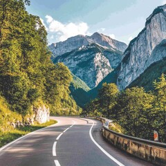 Winding Road Through a Mountain Pass, Scenic Drive. Road Trip, Summer Landscape. The Alps