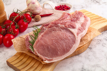 Raw potk loin steak with bone