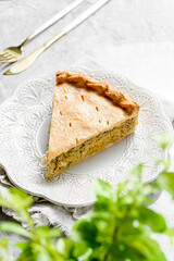 Chicken and egg pie on a light plate