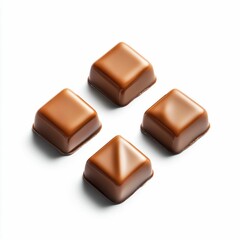 Four Caramel Squares Isolated on White Background