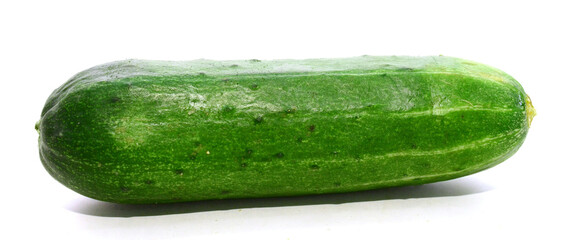 Courgettes (Cucurbita pepo), whole and cut, on white - stock photo
