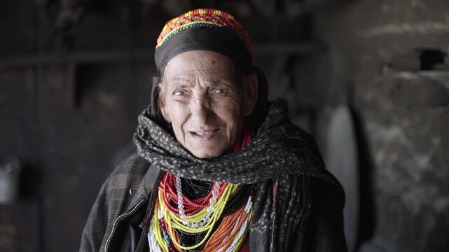 Kalash People. Oldest Woman in Bumburet Valley, Grandmother Kalashi. Elder woman in Hut at Winter, Chitral, Pakistan.