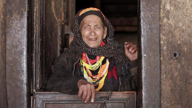 Kalash People. Oldest Woman in Bumburet Valley, Grandmother Kalashi. Elder woman in Hut at Winter, Chitral, Pakistan.