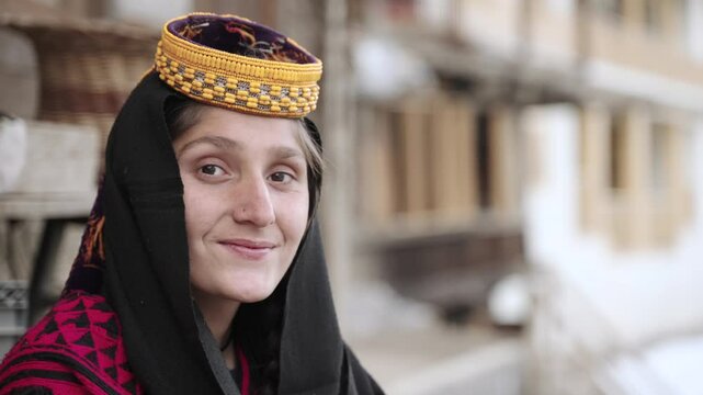 Portrait Young Kalashi Woman, Beautiful Traditionally Dressed girl in in Bumburet Valley at Winter, Chitral, Pakistan.
