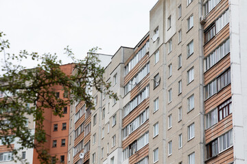 Naklejka premium Modern high-rise apartment buildings in a residential area highlighting rental and mortgage options for residents seeking property insurance