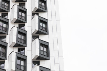 Modern high-rise apartment buildings with distinctive balconies in a residential area showcasing urban living