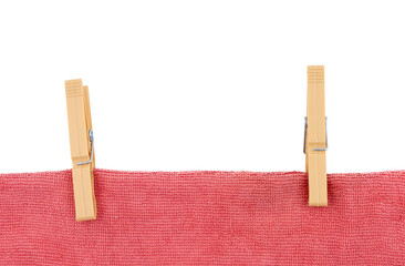 a towel hanging with two clothespins