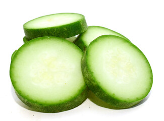 Studio shot of halved cucumber on white background - stock photo
