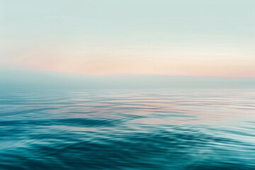 Obraz premium A calm ocean with a beautiful blue sky in the background