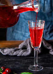 Savoring the Moment: Filling a Glass with Homemade Infused Spirits