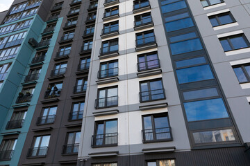 Modern high-rise apartment buildings in a bustling residential area with a focus on rental and mortgage opportunities