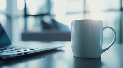 White Mug and Laptop on a Table