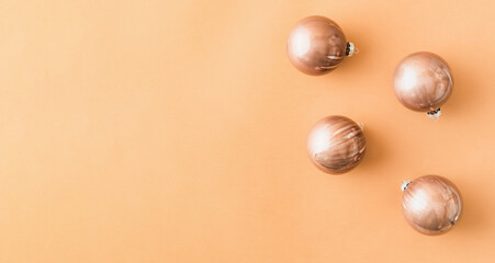 Christmas frame with balls on a colored background