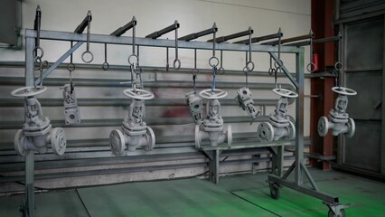 Industrial valves drying after being painted.