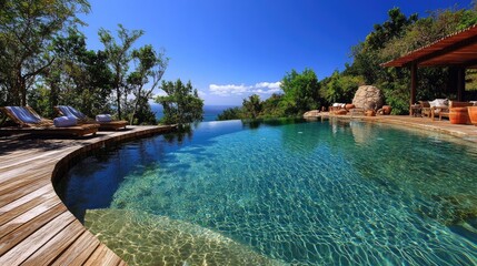 Obraz premium A beautifully designed swimming pool with clear water and a surrounding deck, perfect for a summer getaway.